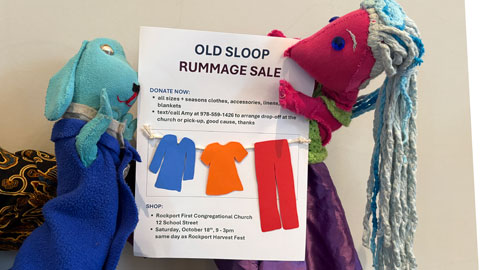 rummage sale poster, held by puppets